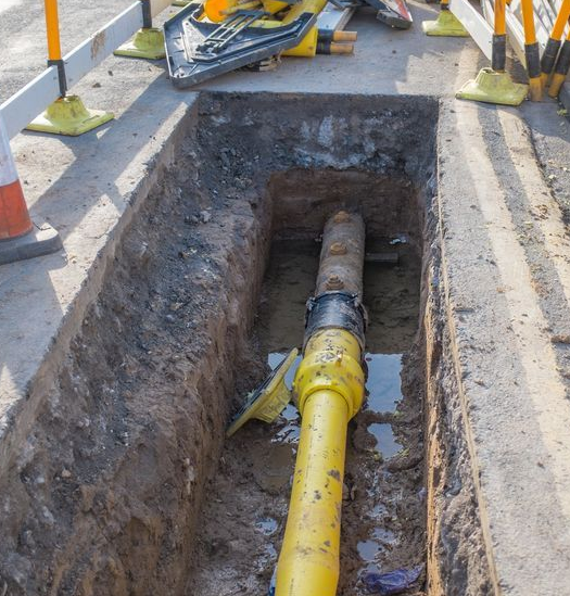 pipe digging in the road